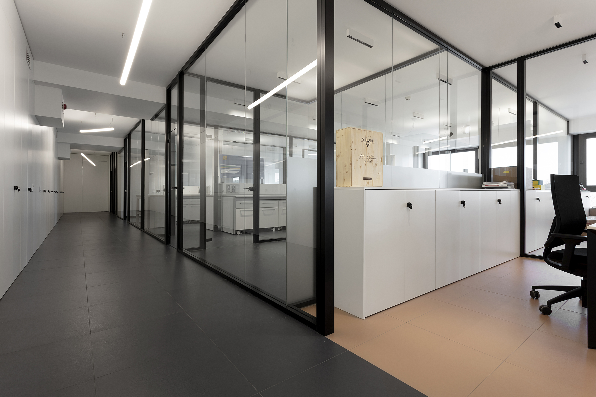 Dark and light tiles in a modern office environment.