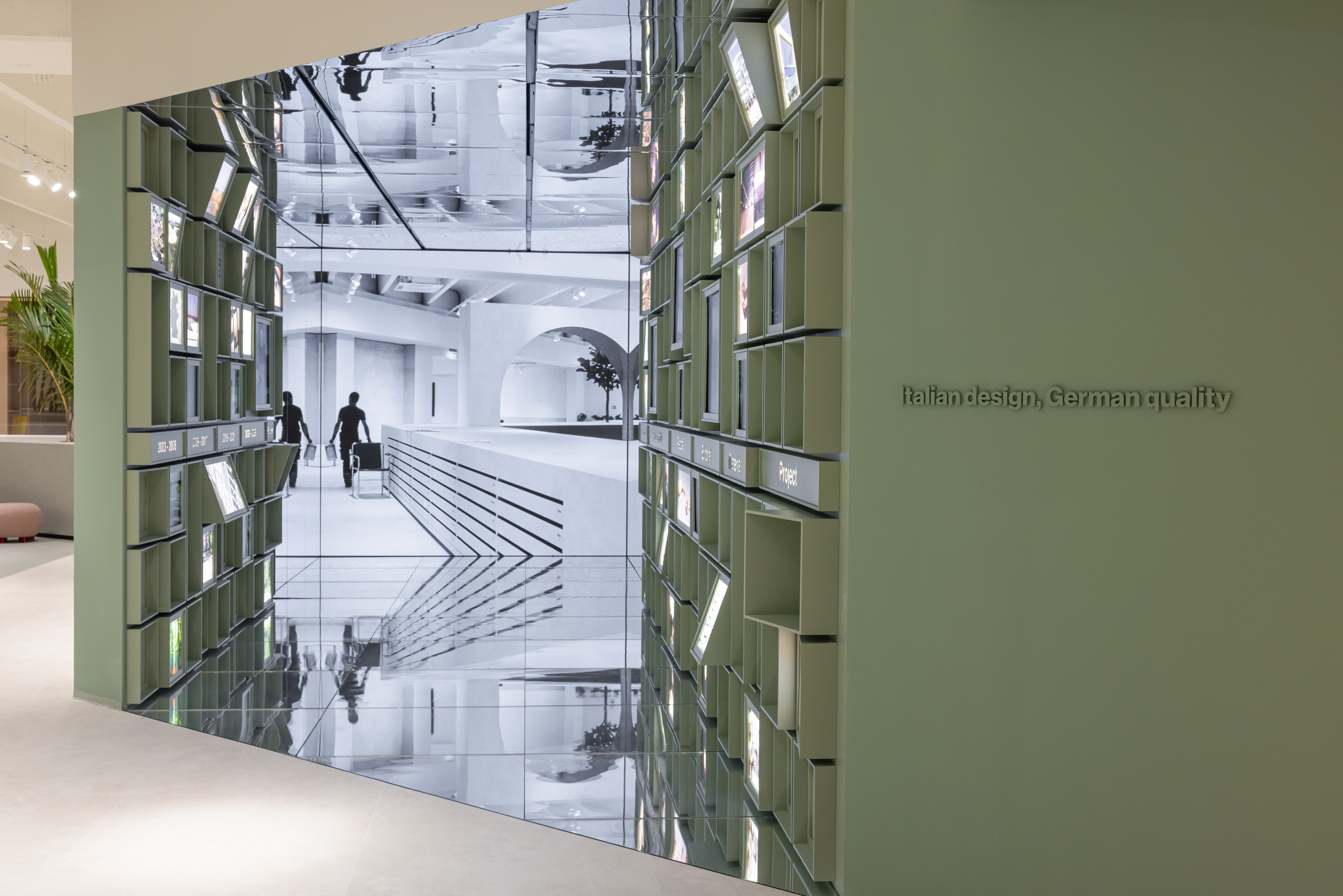 Tile Showroom: Modern presentation with digital display and 'Italian design, German quality'.