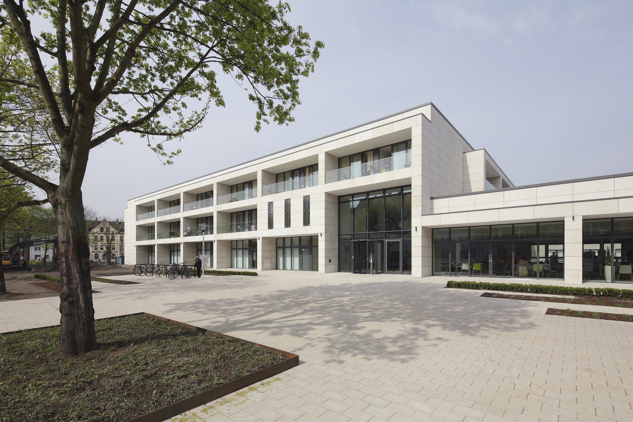 Elegant outdoor space with premium outdoor tiles, modern building.