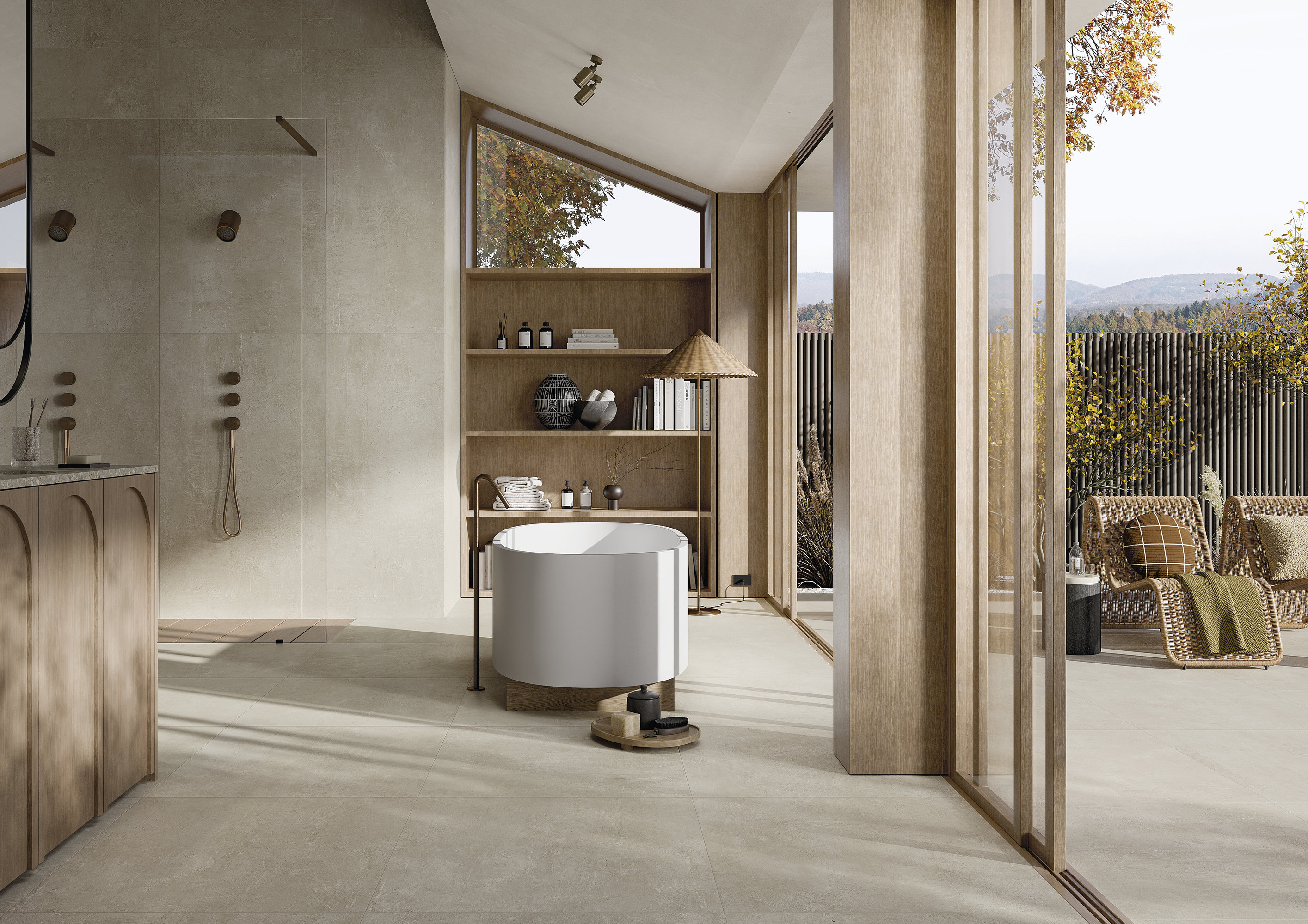 Luxuriöses Badezimmer mit Porcelaingres Fliesen, freistehender Wanne und nahtlosem Übergang zur Terrasse.