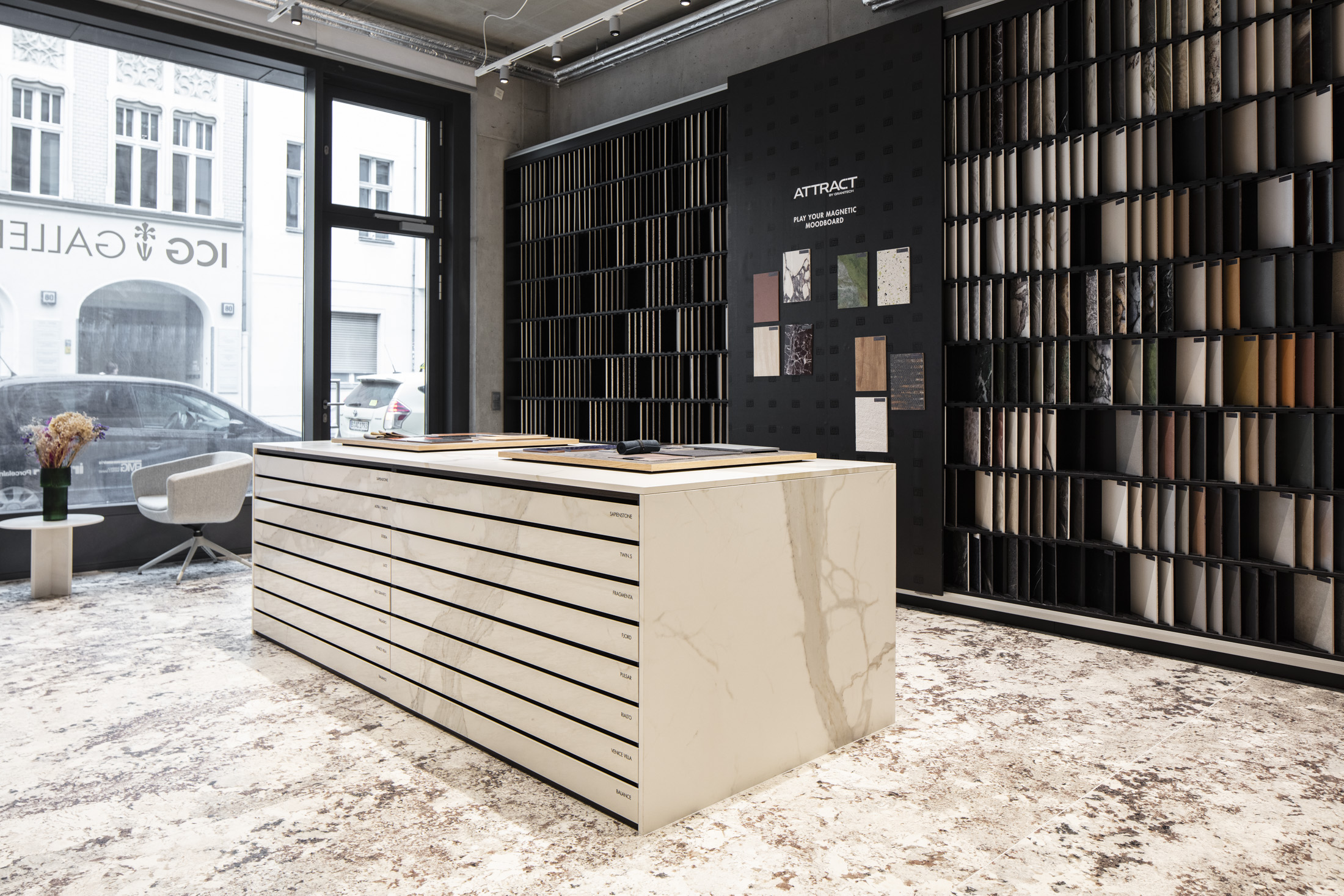 Modern tile showroom with Porcelaingres and Schöner Wohnen tile samples.
